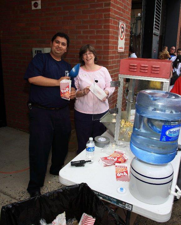 Chip Gul and Mrs Chief Chornock happily bag up the popcorn.